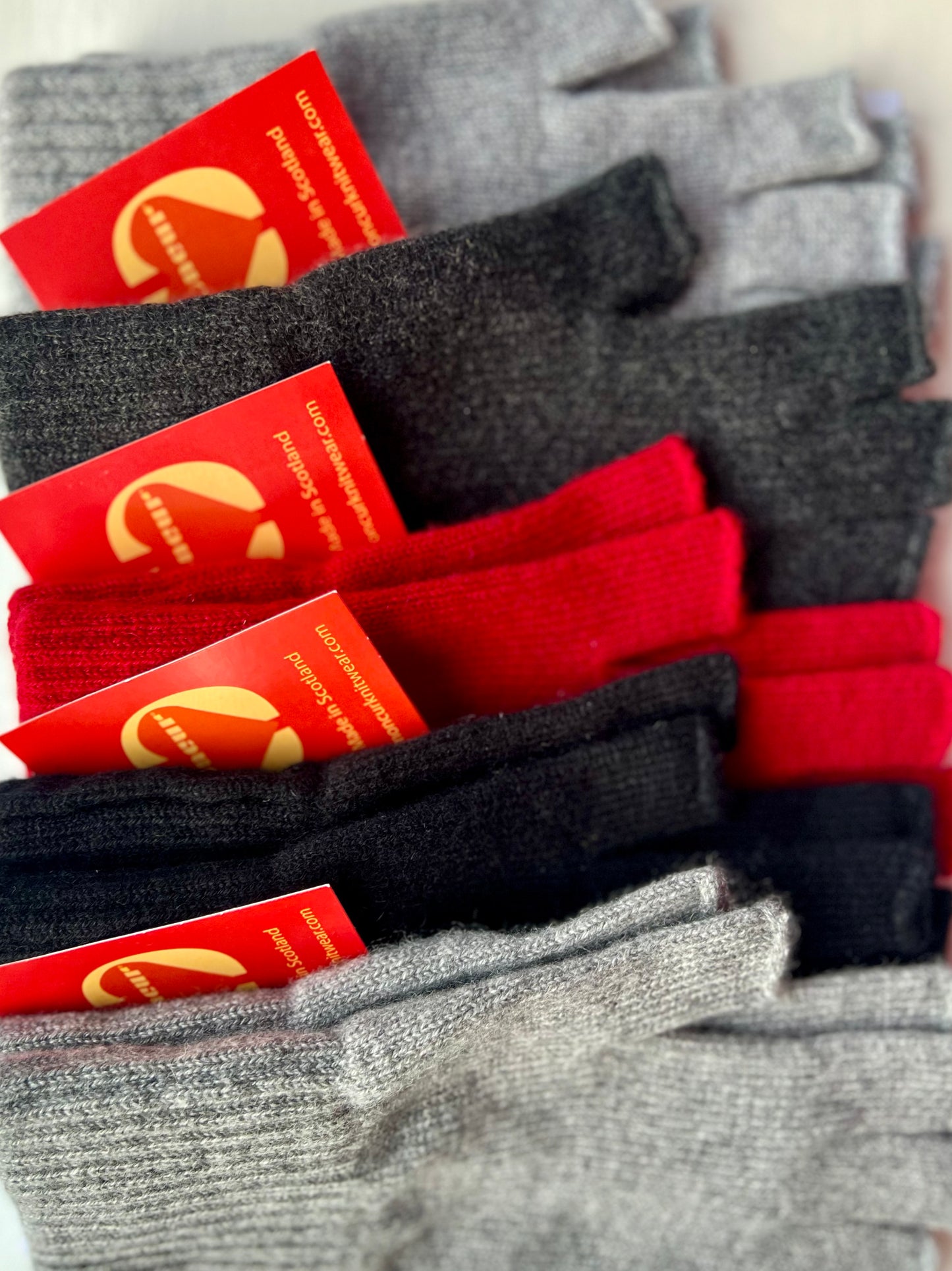 BLACK, RED AND GREY SHADES of Moncur Cashmere Fingerless Gloves. Luxury Colourful Cashmere in Rainbow shades. Made in Scotland.