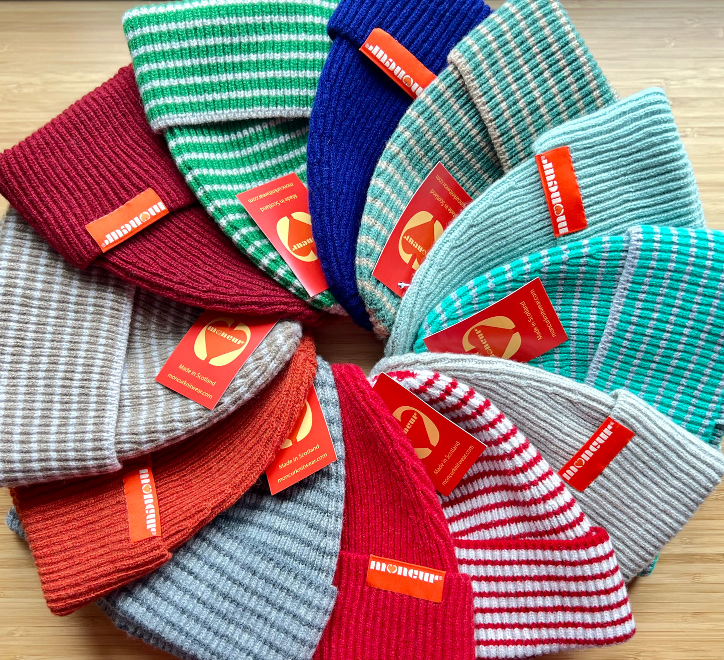 selection of plain and striped lambswool luxuriously soft and cosy hats