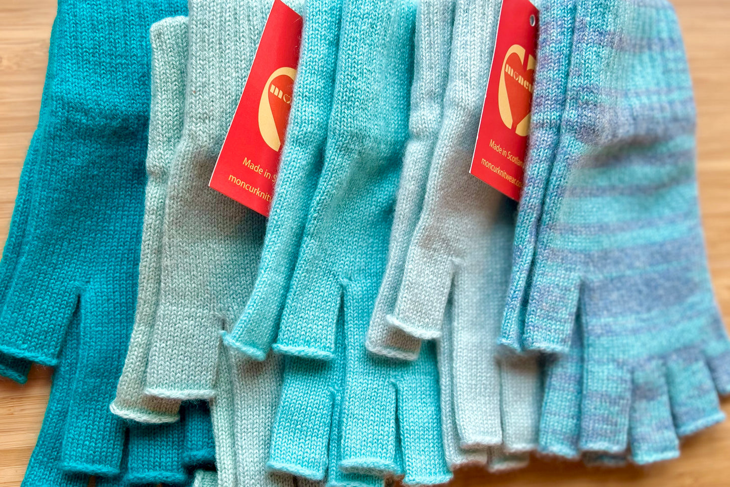 variety of gorgeous turquoise colours available in luxury fingerless cashmere gloves -moncur knitwear