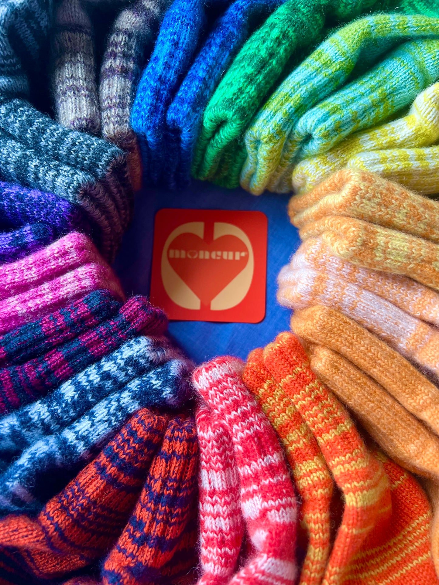 Scottish cashmere full gloves in tutti frutti colourway showing vibrant random stripe pattern