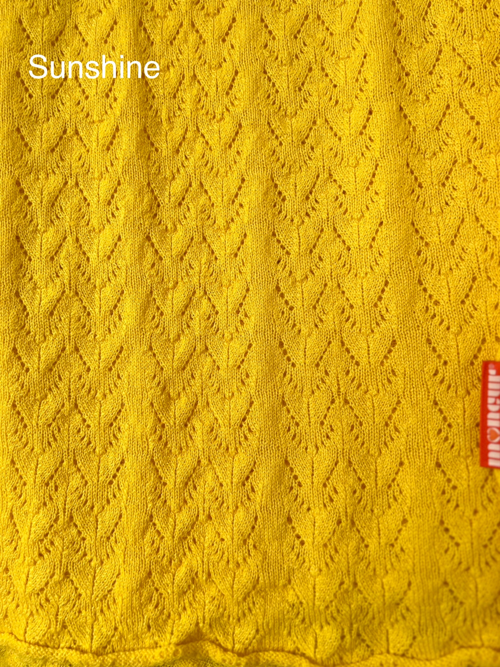 close up of sunshine colour way lace wrap moncur knitwear