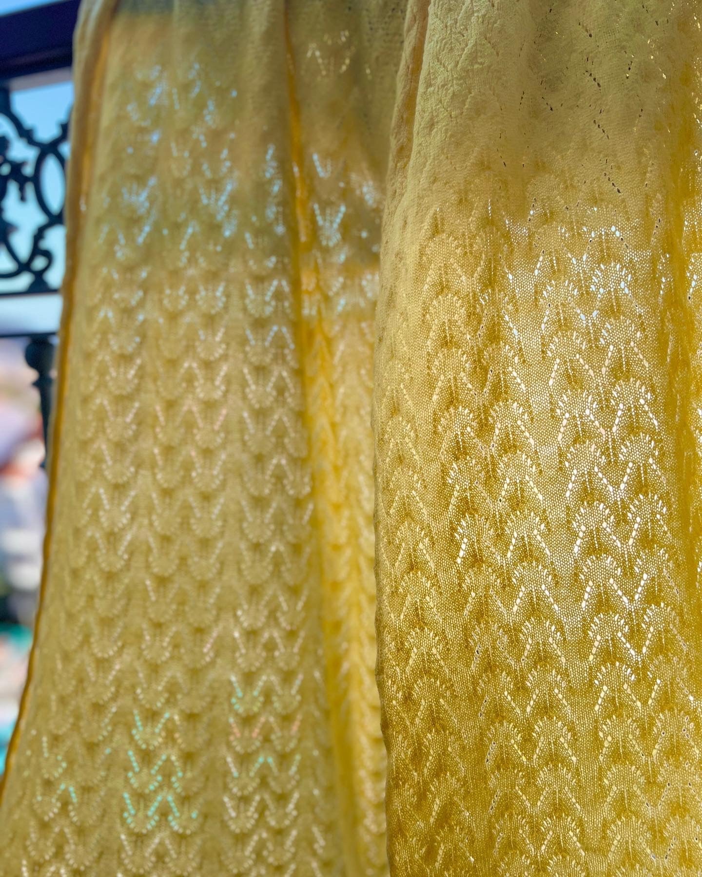 fine lightweight and delicate Lacey cashmere wrap blowing in the gentle breeze on a summer day 