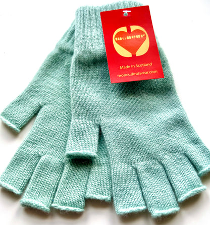 flat lay showing construction of luxury scottish cashmere gloves in a light and soft sea green shade
