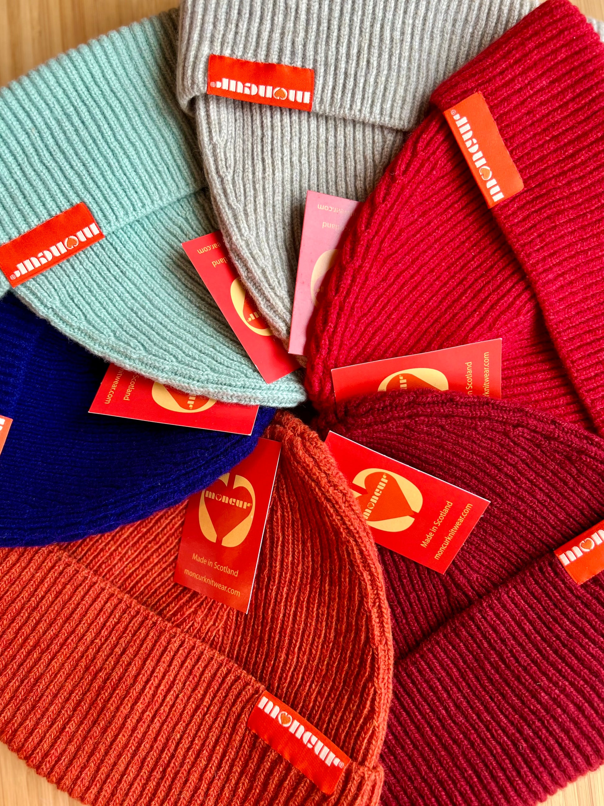 variety of colours ranging from warm reds and oranges to intense cobalt blue and then to softer mint and natural