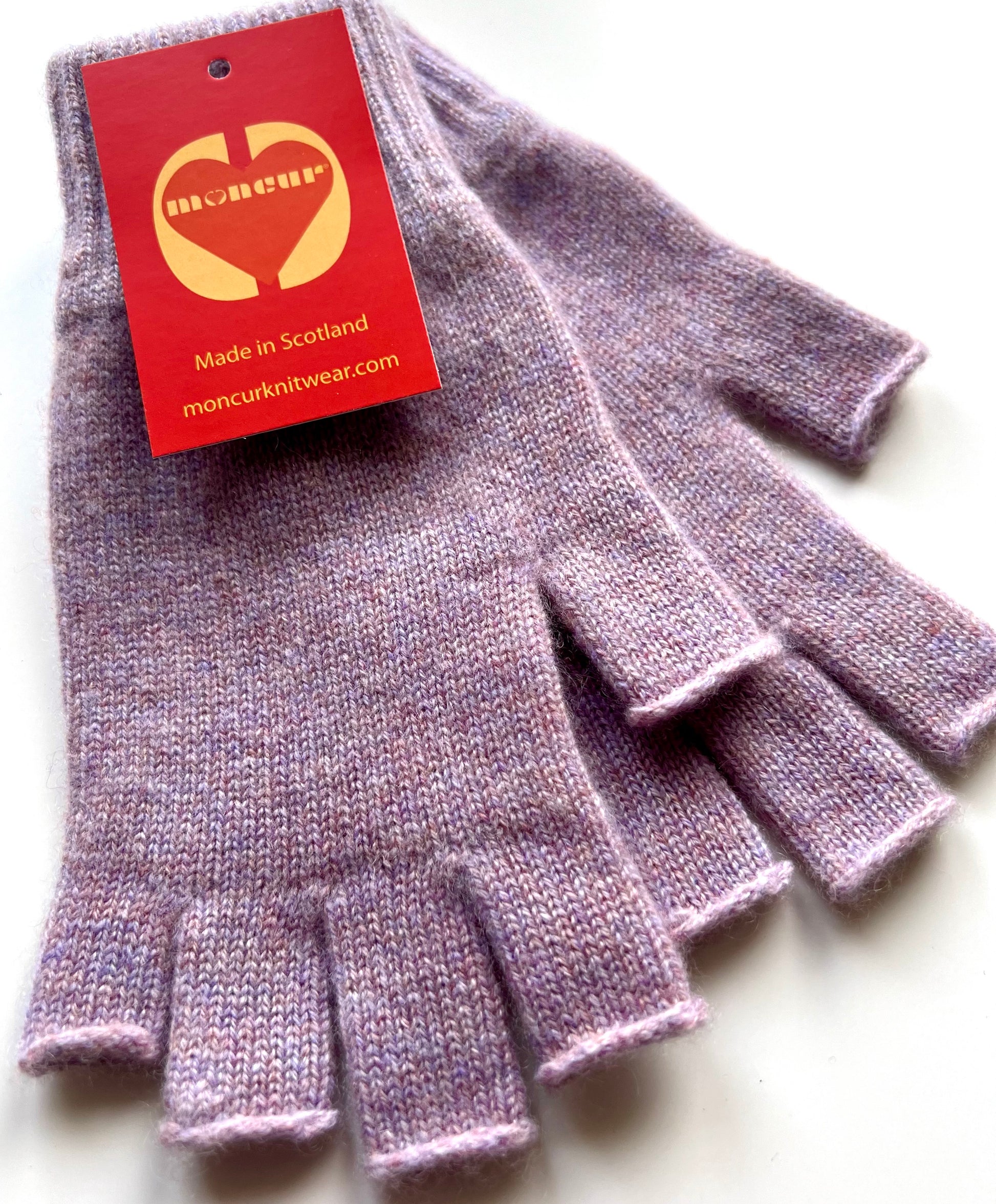 A pair of soft_heather_mix_cashmere fingerless gloves  with tags indicating the brand Moncur Knitwear.