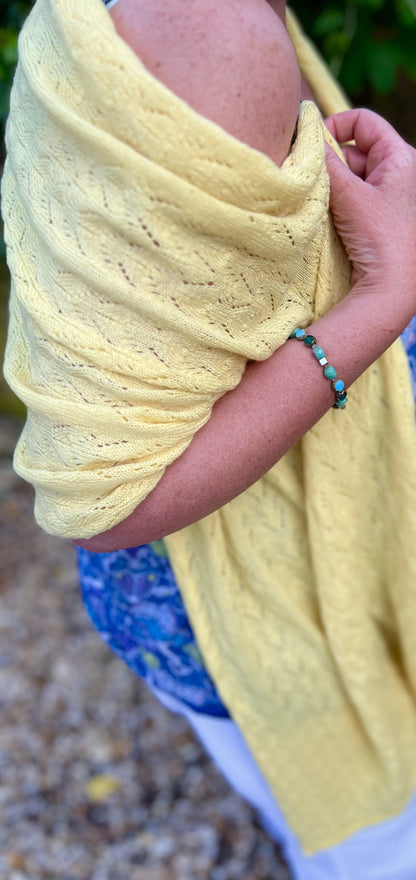 wrapped around shoulders Lacey wrap in cashmere by moncur knitwear showing a two metre length of soft luxury 